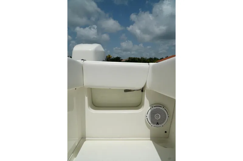  Yacht Photos Pics 2017 SeaVee 34Z boat interior with speaker, white seating, and blue sky background.
