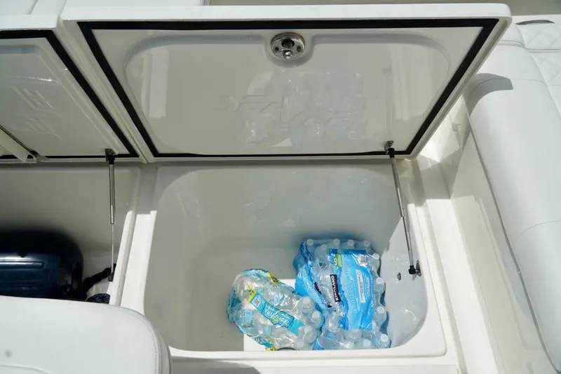  Yacht Photos Pics Open storage compartment on 2017 SeaVee 34Z boat with bottled water inside.