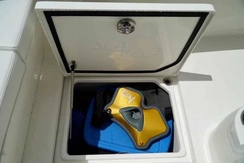  Yacht Photos Pics Storage compartment on 2017 SeaVee 34Z boat with yellow and blue equipment inside.