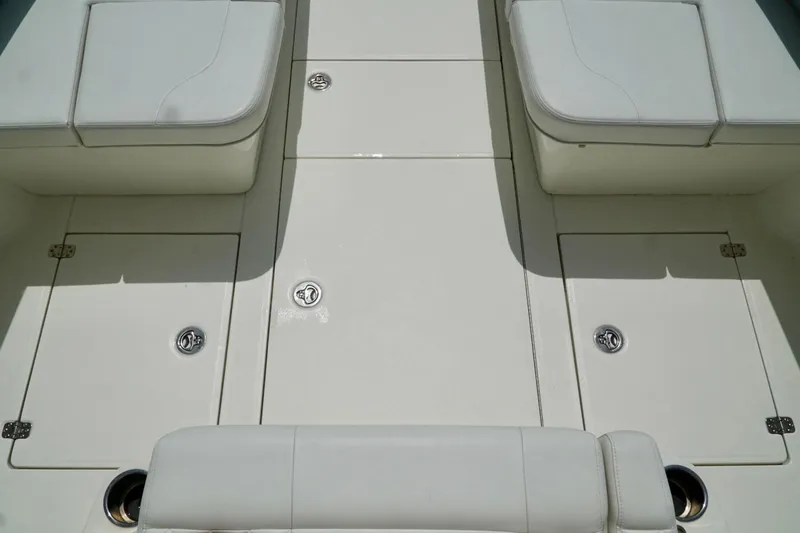  Yacht Photos Pics 2017 SeaVee 34Z boat deck with cushioned seating and storage compartments.