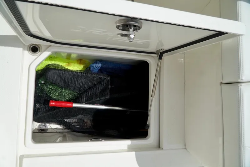  Yacht Photos Pics Storage compartment on a 2017 SeaVee 34Z boat with fishing gear inside.