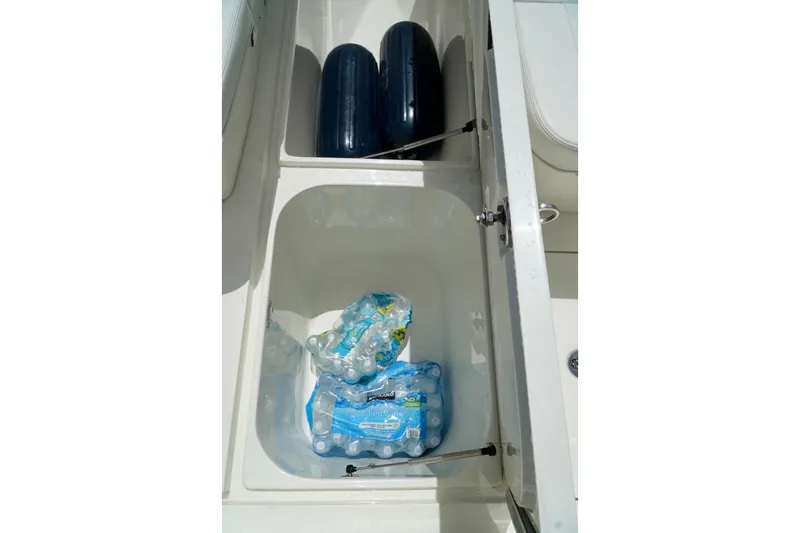  Yacht Photos Pics Storage compartments on a 2017 SeaVee 34Z boat with water bottles and fenders.