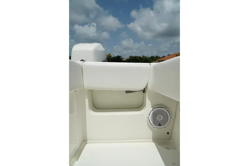  Yacht Photos Pics 2017 SeaVee 34Z boat interior with speaker, white seating, and blue sky background.