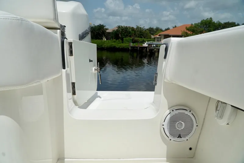  Yacht Photos Pics 2017 SeaVee 34Z boat interior with open hatch and speaker, dockside view.