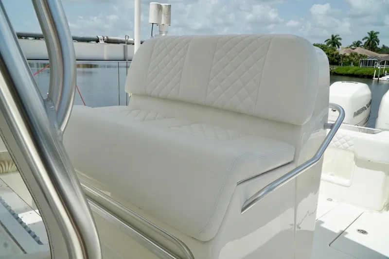 Yacht Photos Pics 2017 SeaVee 34Z boat with white cushioned seating and stainless steel railing.