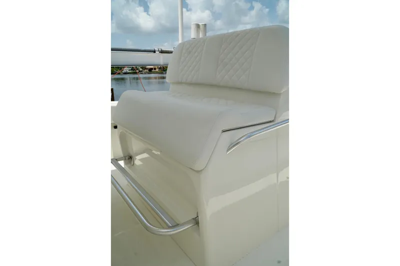  Yacht Photos Pics 2017 SeaVee 34Z boat seat with white upholstery and stainless steel footrest.