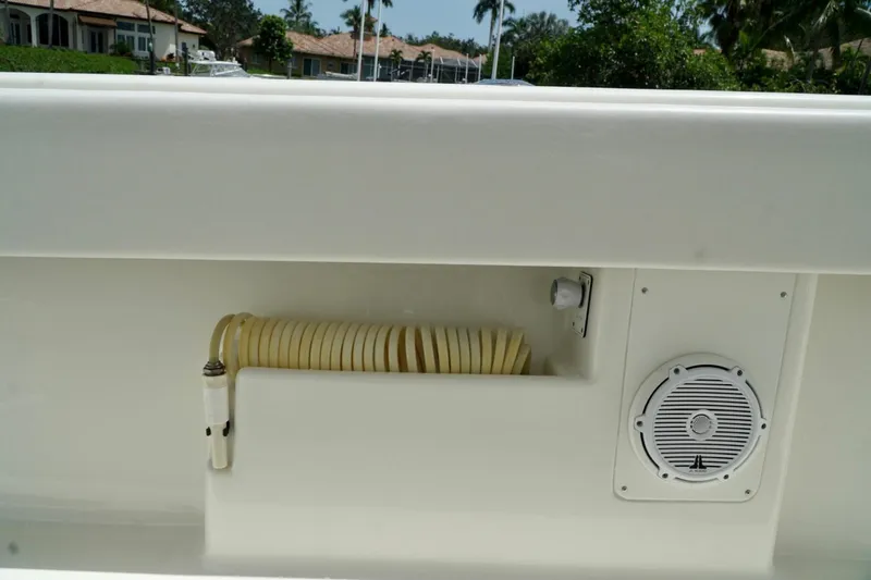  Yacht Photos Pics 2017 SeaVee 34Z boat deck with coiled hose and speaker.