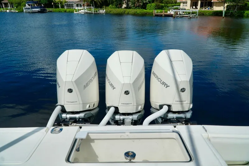  Yacht Photos Pics 2017 SeaVee 34Z boat with triple Mercury Verado outboard engines on a calm lake.
