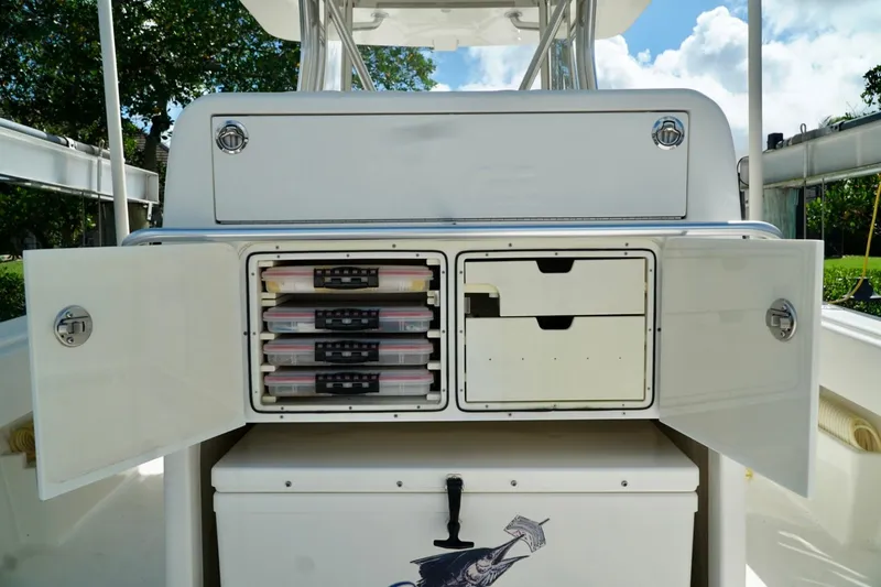  Yacht Photos Pics 2017 SeaVee 34Z boat storage compartments with open doors and organized tackle boxes.