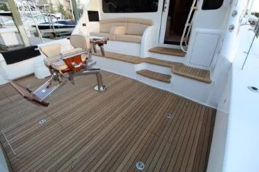 Slabjack Yacht Photos Pics 2017 Viking 55 Convertible yacht with teak deck and comfortable seating area.