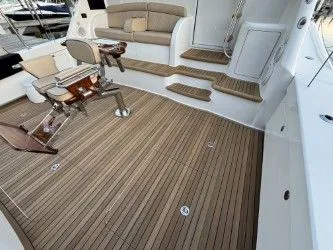 Slabjack Yacht Photos Pics 2017 Viking 55 Convertible yacht with teak deck and comfortable seating area.