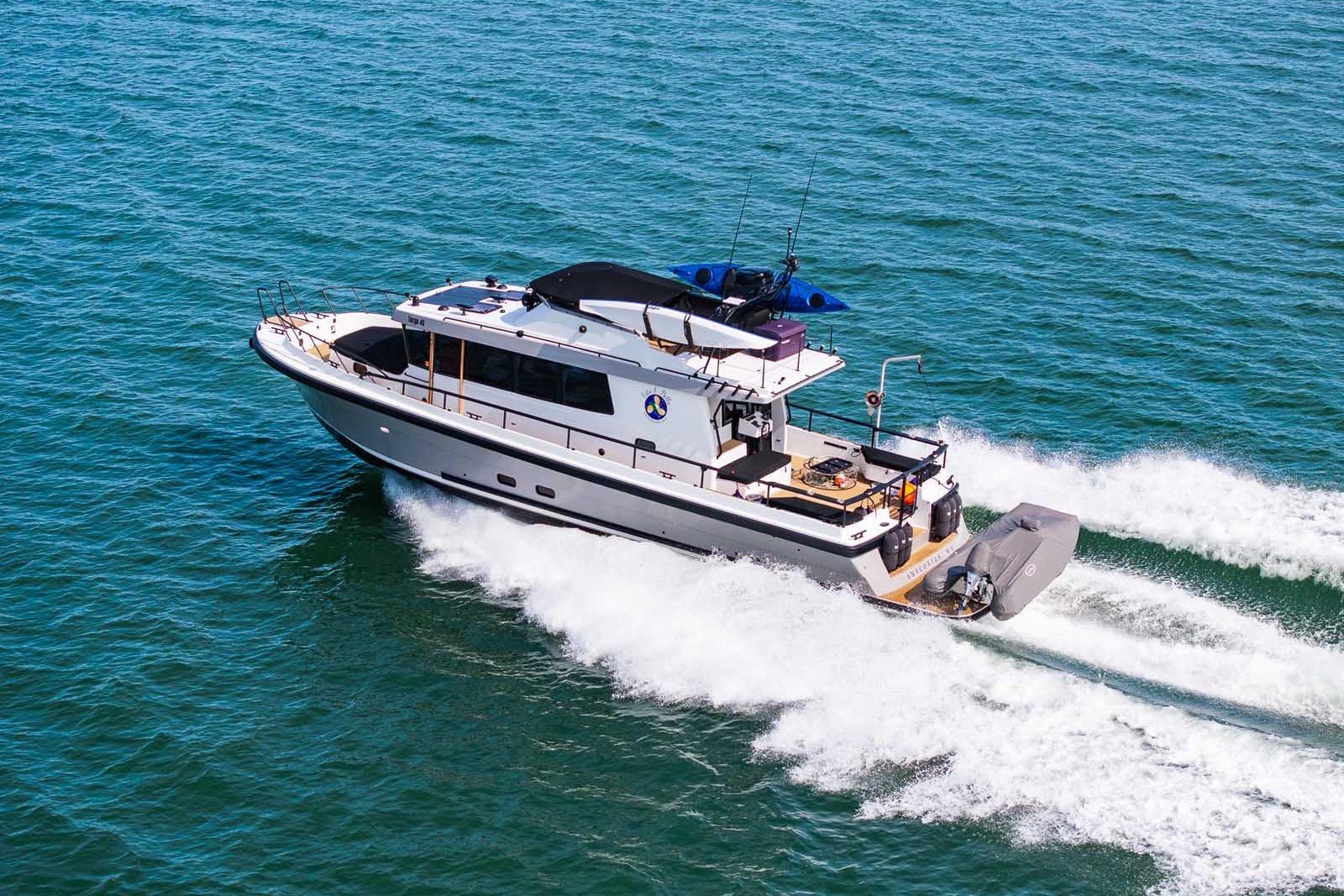 2025 Targa 46 yacht cruising on open sea, showcasing sleek design and performance.