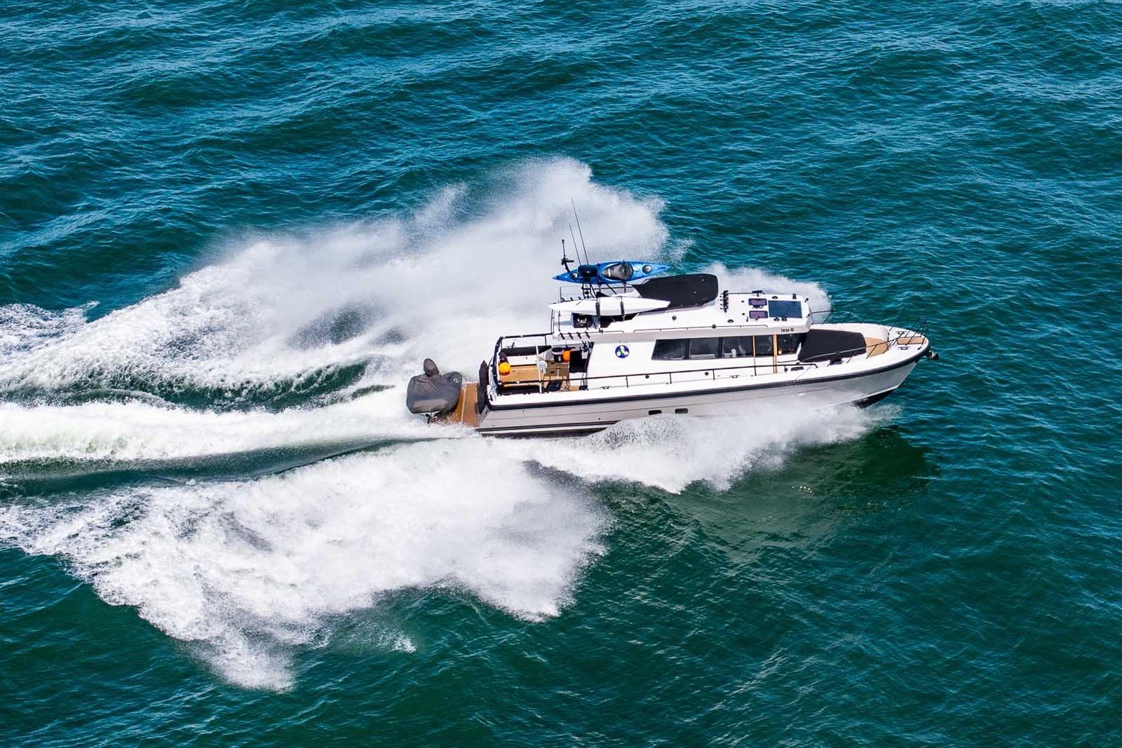 Aerial view of 2025 Targa 46 boat speeding on open water.