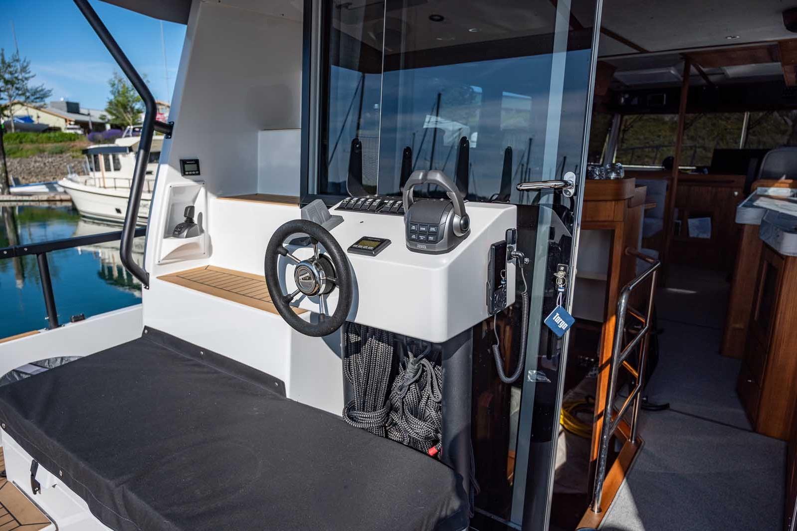 2025 Targa 46 boat helm with modern controls and sleek interior design.