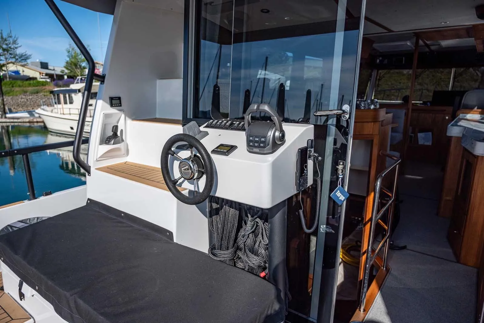 2025 Targa 46 boat helm with modern controls and sleek interior design.