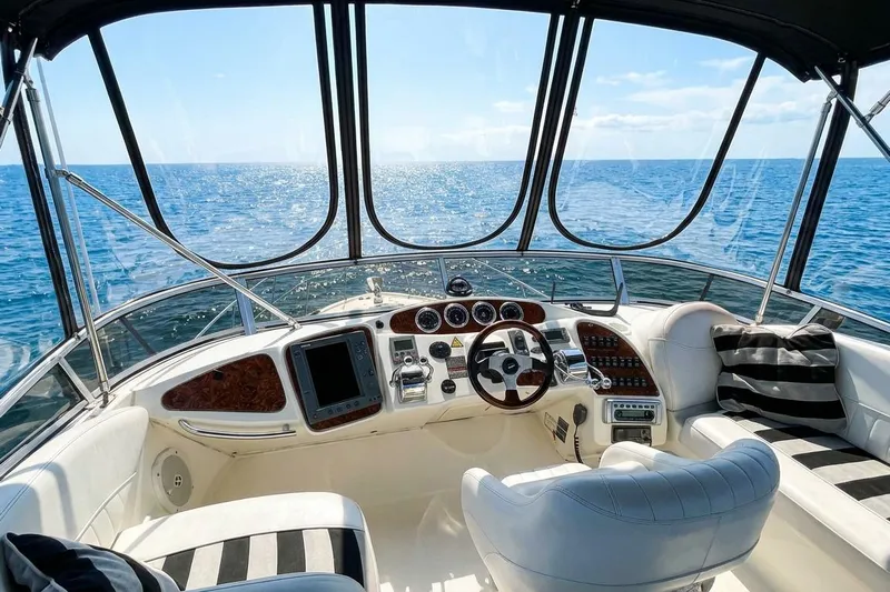 Jamm Yacht Photos Pics Luxurious 2005 Meridian 459 Motoryacht helm with ocean view and plush seating.