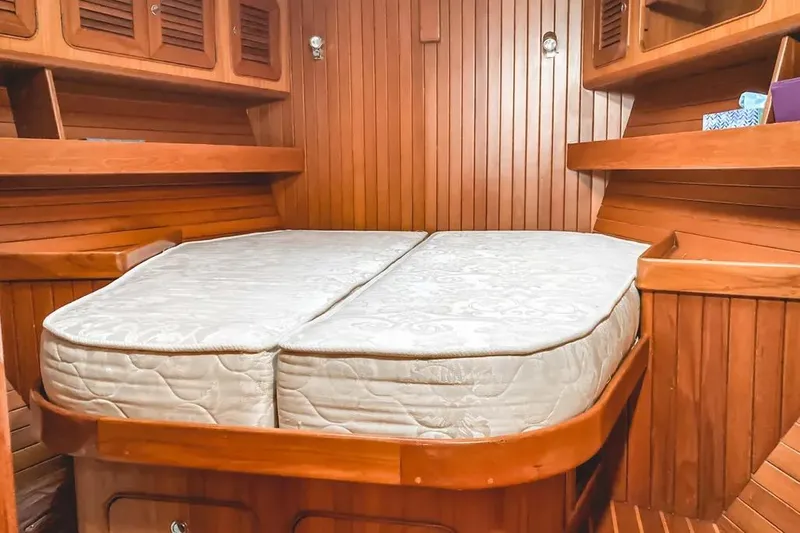 Violina Yacht Photos Pics Cozy wooden cabin interior of 1999 Hylas 54 yacht with double bed.