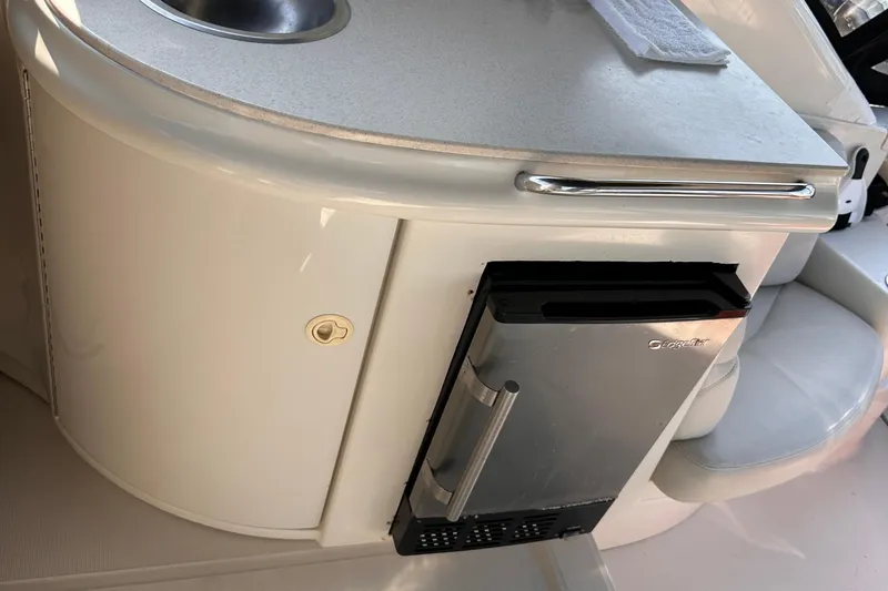  Yacht Photos Pics 2001 Regal Commodore 4160 yacht kitchenette with sink and compact fridge.