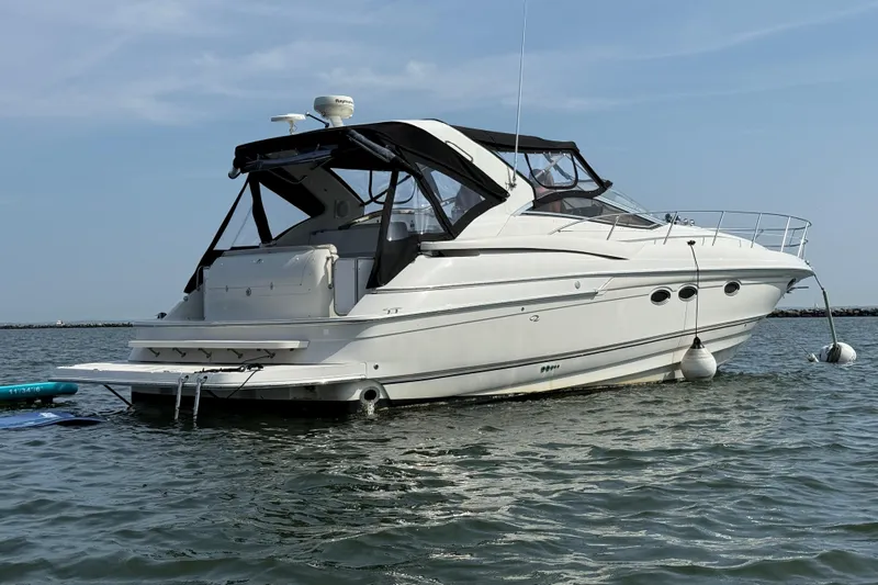  Yacht Photos Pics 2001 Regal Commodore 4160 yacht on calm water, featuring sleek design and modern amenities.