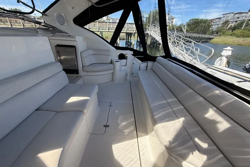  Yacht Photos Pics Luxurious interior of 2001 Regal Commodore 4160 yacht with white seating and scenic view.