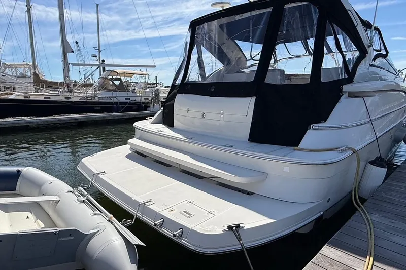  Yacht Photos Pics 2001 Regal Commodore 4160 yacht docked at marina with inflatable boat nearby.
