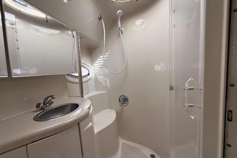  Yacht Photos Pics Bathroom interior of 2001 Regal Commodore 4160 yacht with shower and sink.