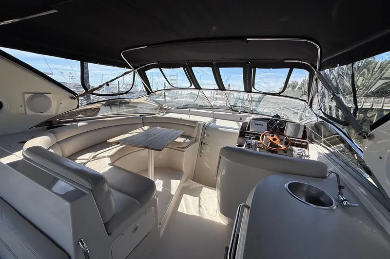  Yacht Photos Pics Interior of 2001 Regal Commodore 4160 yacht with seating and helm.