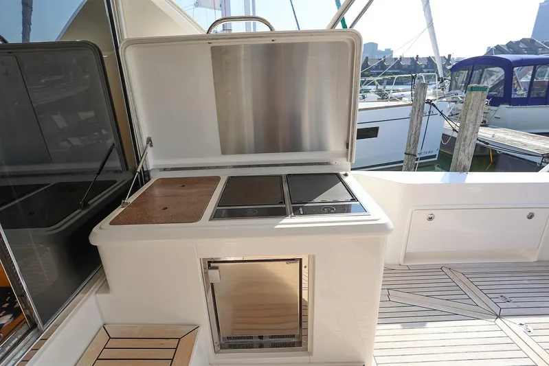 Yacht Photos Pics Outdoor kitchen on 2016 Riviera 525 SUV yacht with grill and storage.