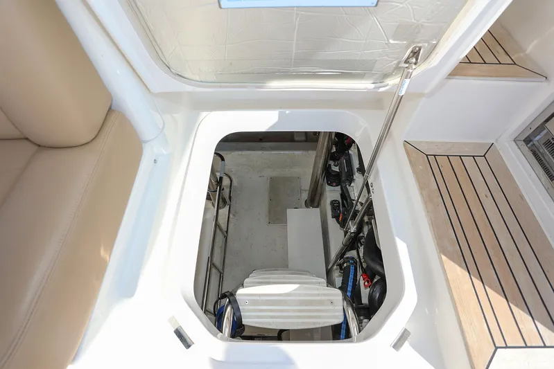  Yacht Photos Pics 2016 Riviera 525 SUV engine compartment with open hatch and visible machinery.