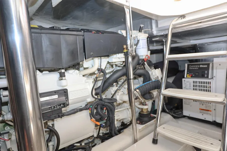  Yacht Photos Pics Engine room of 2016 Riviera 525 SUV with visible machinery and ladder.
