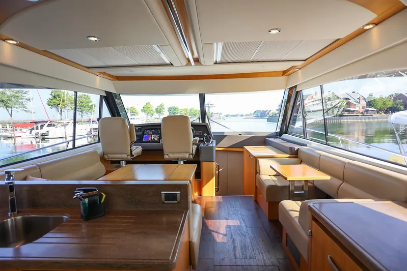  Yacht Photos Pics Interior of 2016 Riviera 525 SUV yacht, featuring luxurious seating and panoramic windows.