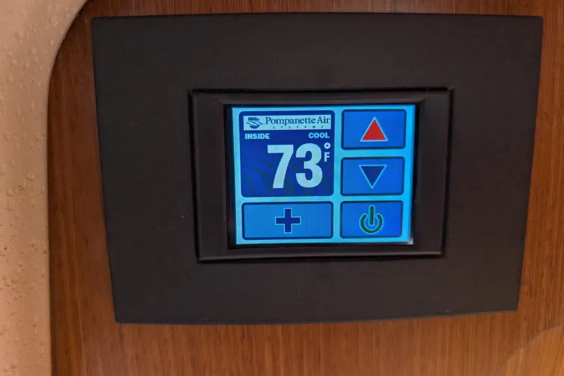 Uno Mas Yacht Photos Pics Digital thermostat display in 2021 Catalina 315, showing 73&deg;F with control buttons.