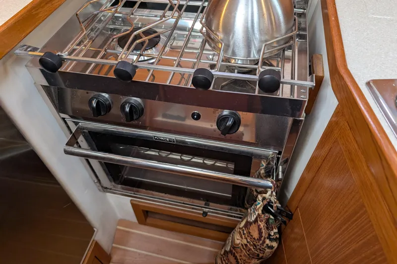 Uno Mas Yacht Photos Pics Stainless steel stove and oven in 2021 Catalina 315 yacht kitchen.