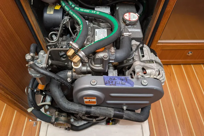 Uno Mas Yacht Photos Pics Engine compartment of a 2021 Catalina 315 sailboat, showcasing detailed mechanical components.