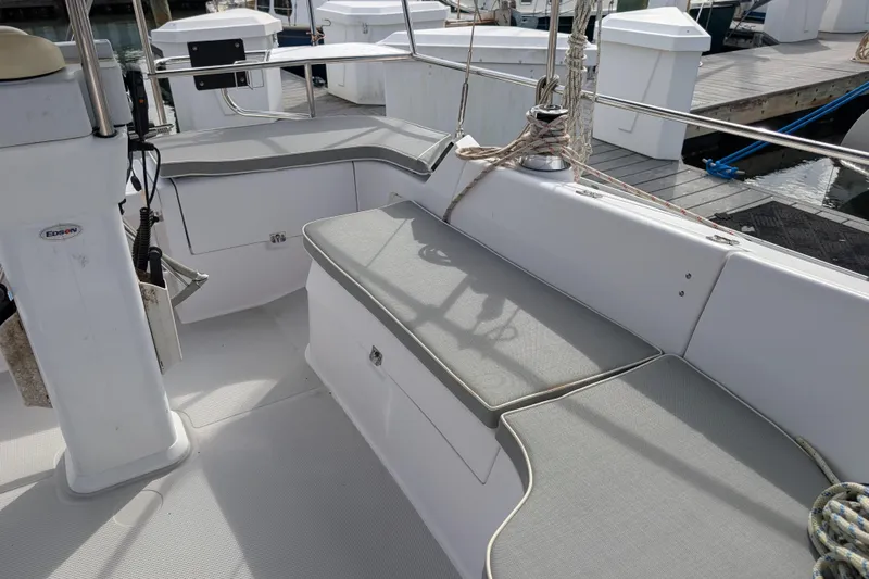 Uno Mas Yacht Photos Pics 2021 Catalina 315 sailboat cockpit with cushioned seating and winch, docked at marina.