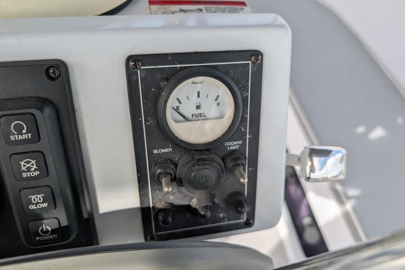 Uno Mas Yacht Photos Pics Control panel of a 2021 Catalina 315 sailboat with fuel gauge and switches.