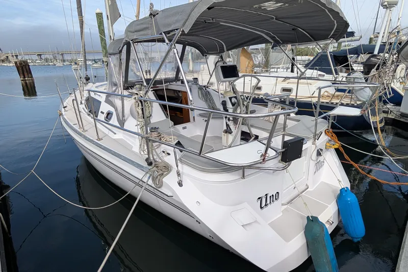 Uno Mas Yacht Photos Pics 2021 Catalina 315 sailboat docked in marina, featuring sleek design and modern amenities.