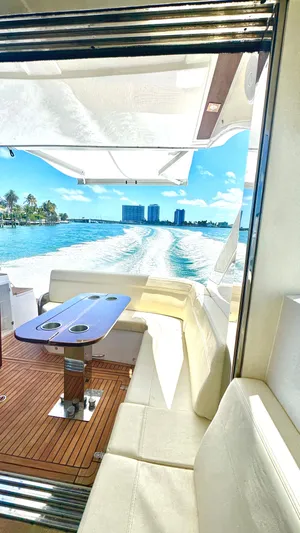  Yacht Photos Pics Luxurious 2022 Evolve 400HT yacht interior with ocean view and sleek seating area.