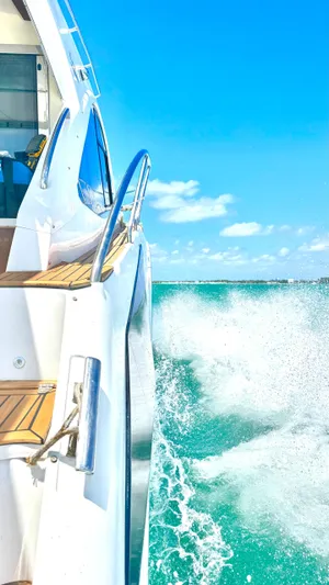  Yacht Photos Pics Evolve 400HT yacht cruising on turquoise waters under a clear blue sky, 2022 model.