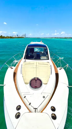  Yacht Photos Pics 2022 Evolve 400HT yacht cruising on turquoise waters under a clear blue sky.