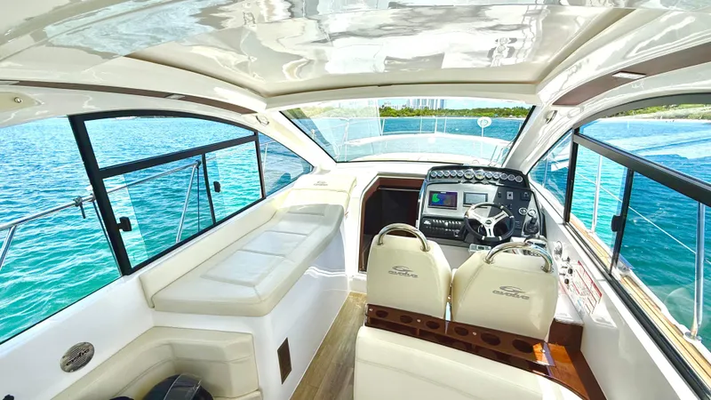  Yacht Photos Pics Luxurious interior of 2022 Evolve 400HT yacht with modern dashboard and seating.