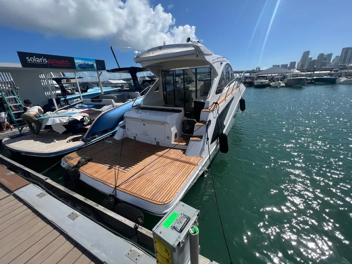  Yacht Photos Pics Evolve 400HT 2022 yacht docked at marina under clear blue sky.
