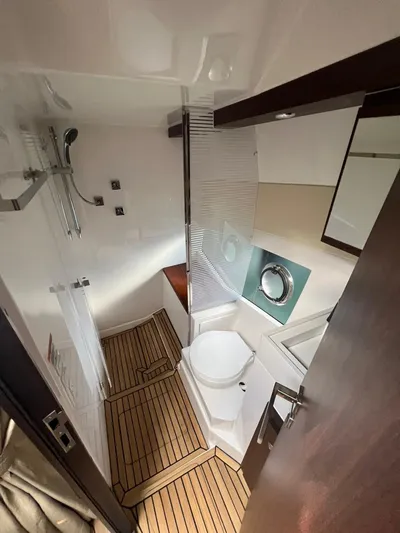  Yacht Photos Pics Modern bathroom in 2022 Evolve 400HT yacht with wood flooring and sleek fixtures.