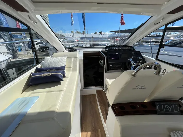  Yacht Photos Pics Interior of 2022 Evolve 400HT yacht with luxurious seating and modern helm.