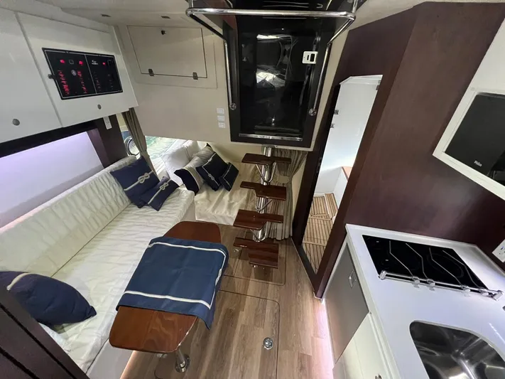  Yacht Photos Pics Interior of 2022 Evolve 400HT yacht with modern kitchen and seating area.