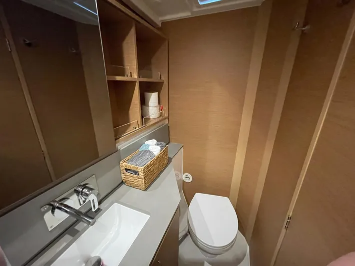 Artemis Yacht Photos Pics Modern bathroom in 2022 Excess 12 yacht with sink, toilet, and storage shelves.