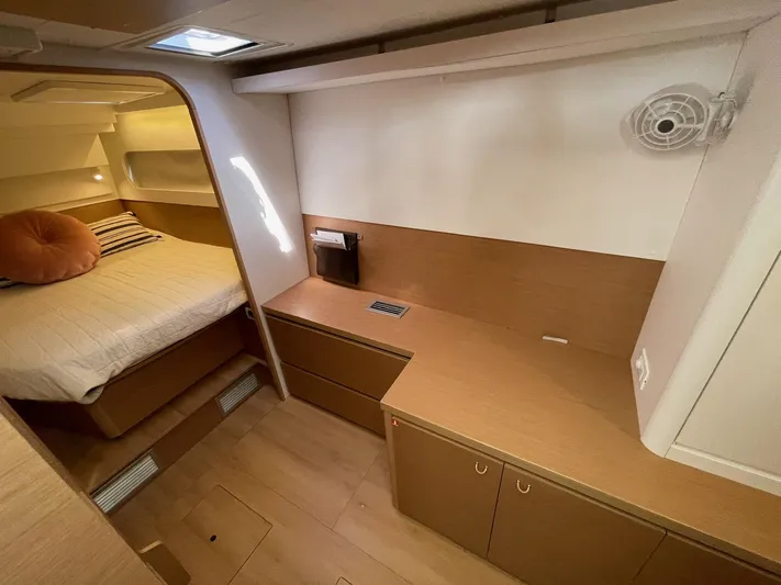 Artemis Yacht Photos Pics Interior of 2022 Excess 12 yacht cabin with bed and storage cabinets.