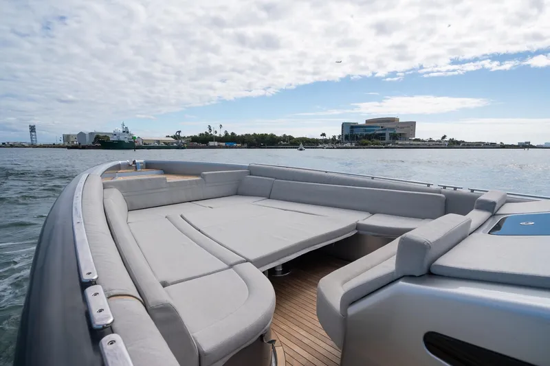 Sea Sea II Yacht Photos Pics Novamarine BS 160 Outboard 2022 boat with spacious deck, cruising near coastal buildings.