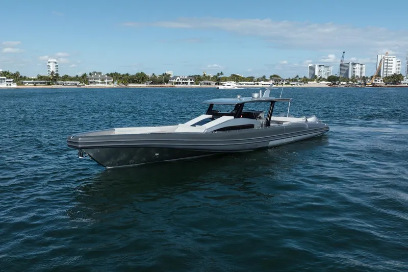 Sea Sea II Yacht Photos Pics 2022 Novamarine BS 160 Outboard boat cruising on a sunny day near a coastal cityscape.