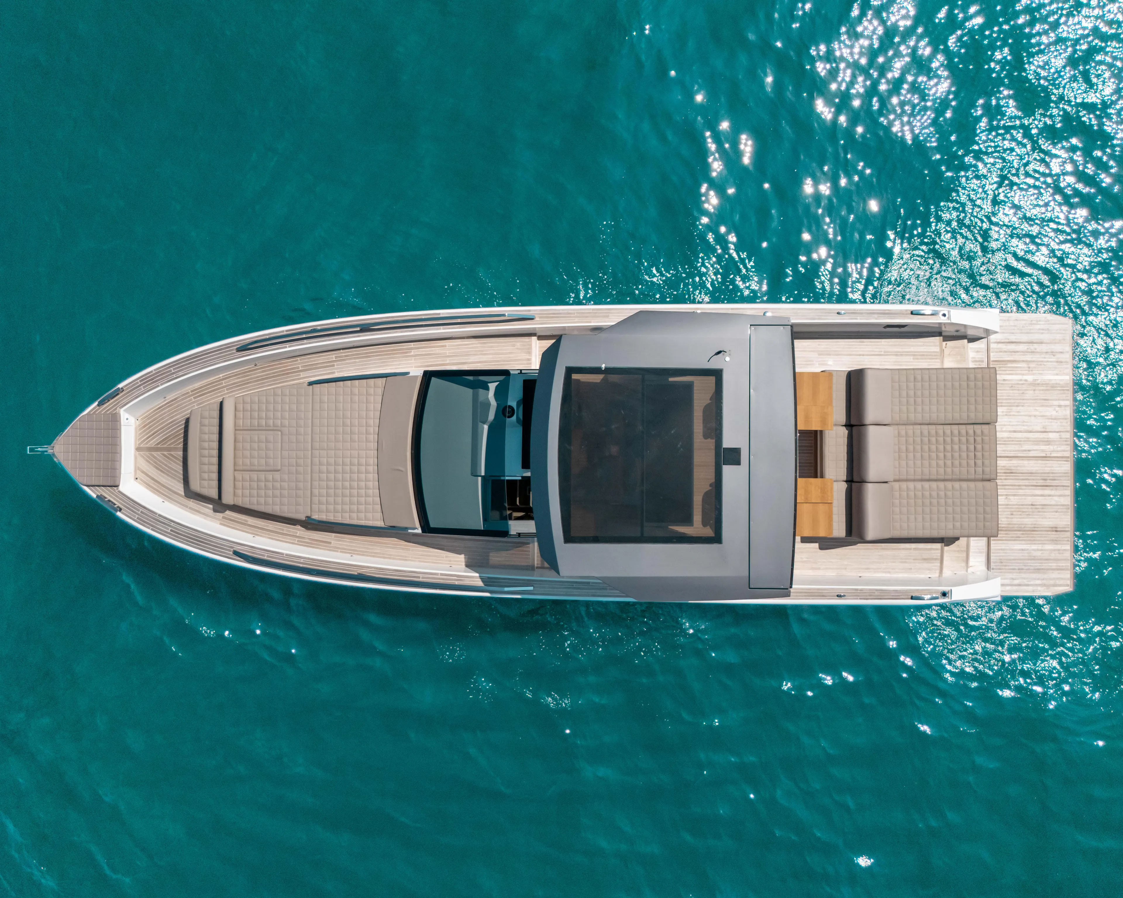  Yacht Photos Pics Aerial view of 2023 Fiart SEAWALKER 43 yacht on clear blue water.